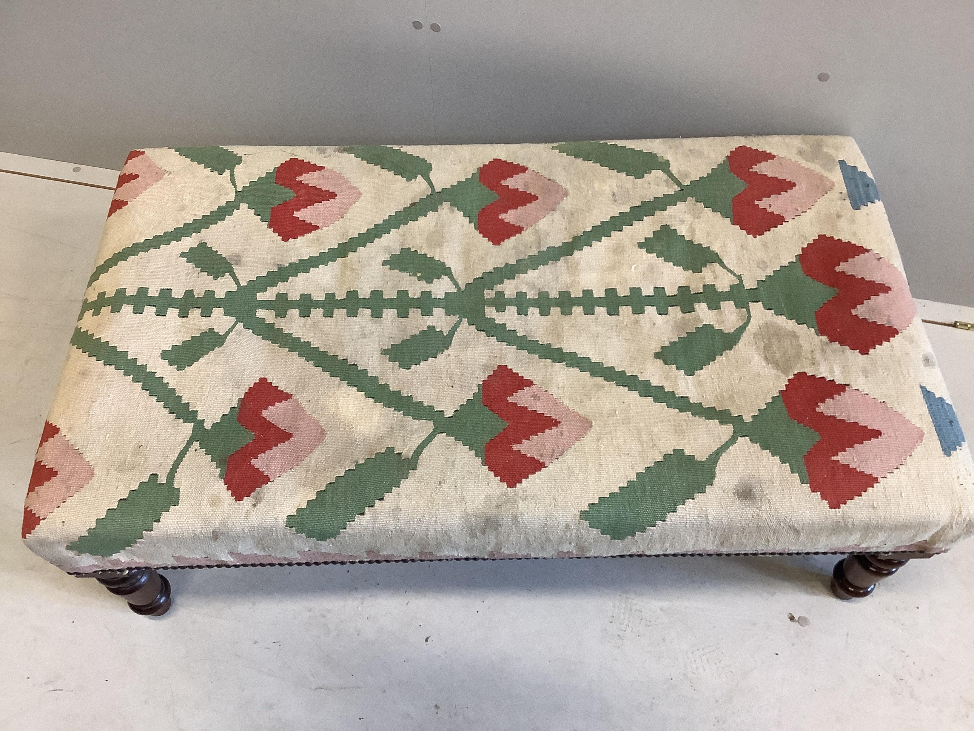 A Victorian style rectangular stool with Kilim covered seat on turned mahogany legs, width 111cm, depth 62cm, height 36cm